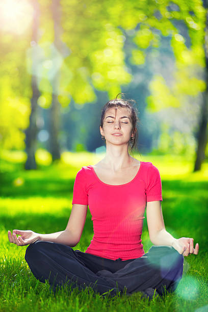 istock Young woman doing yoga exercises 469802918