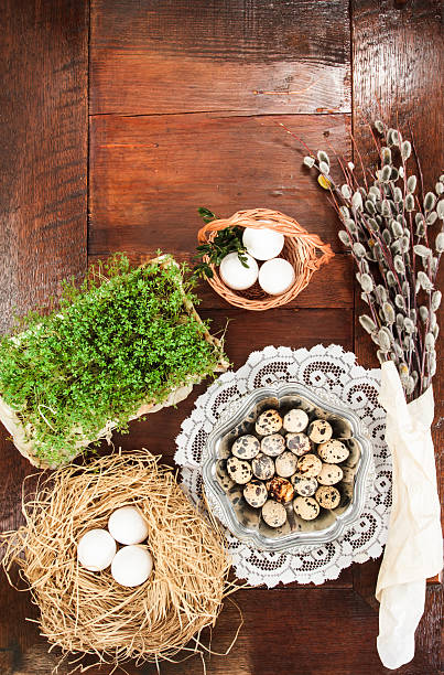 istock Easter composition of catkins, eggs and cress on wooden table 469803538