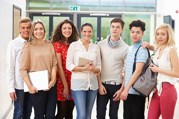 istock Portrait Of Female Tutor In Class With Students 469804093