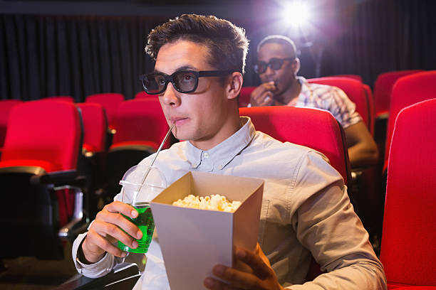 istock Young friends watching a 3d film 469805736