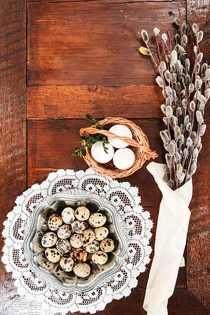 istock Easter composition of catkins and eggs on wooden table 469805778