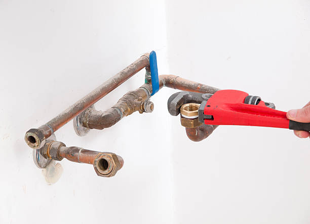 istock Hands repairing plumbing pipes 469809027