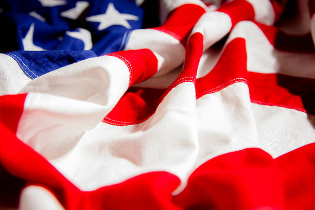 istock American flag with folds. Side view. Dramatic lighting. Patriotism. 469810672