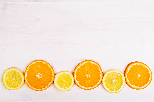 istock Fresh oranges and lemons on wooden background 469810718