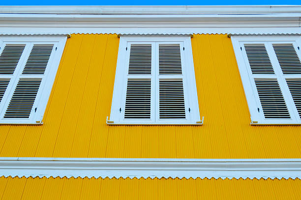 istock Yellow house with three windows in valparaiso 469810936