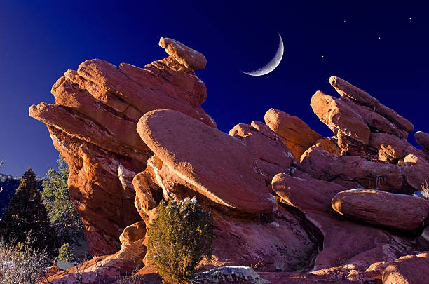 This is a unique rock formation found at the heart of the Garden of the Gods Park in Colorado Springs, Colorado. I shot this right at sunset and tweaked it a little and added the crescent moon for effect. It is nick-named \