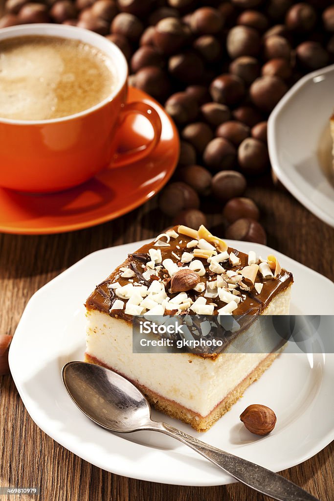 cheesecake with nuts on plate cheesecake with nuts on plate, dark background, selective focus Animal Egg Stock Photo
