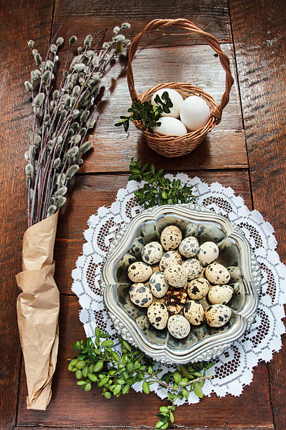 istock Easter composition of catkins and eggs on wooden table 469811426
