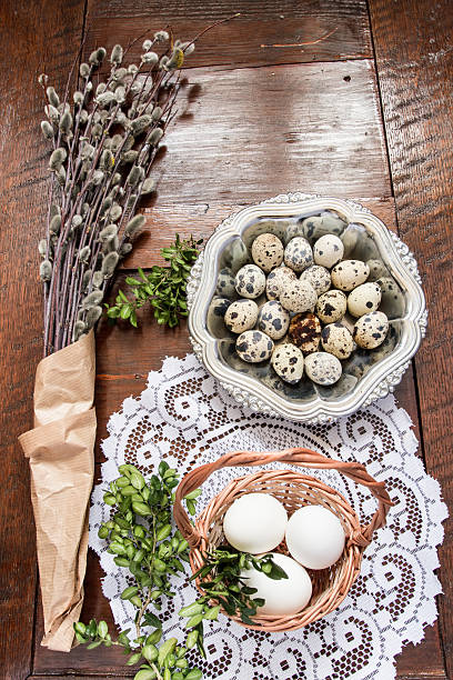 istock Easter composition of catkins, eggs and cress on wooden table 469811440