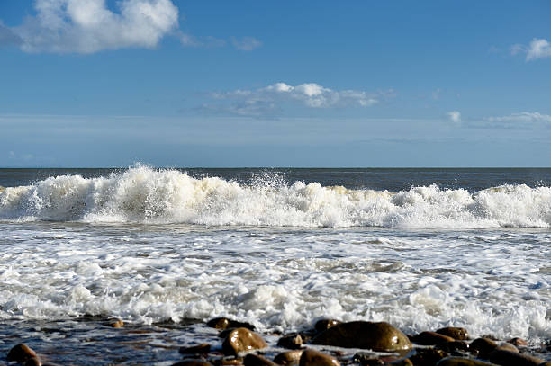 istock Waves breaking on a rocky beach in south west Scotland 469811588