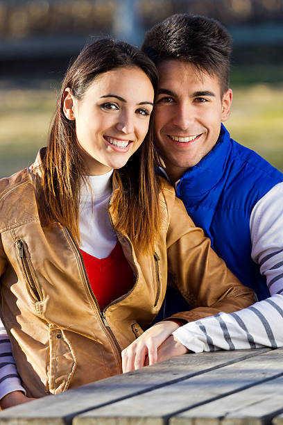 istock young couple in the park 469811711