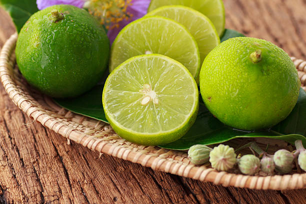 istock Lime on wooden background - Stock Image 469814924