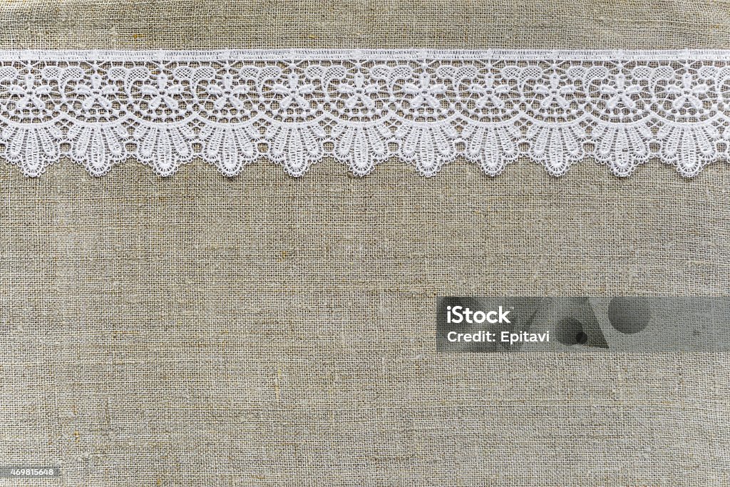 Textile background Lace border over burlap Lace - Textile Stock Photo