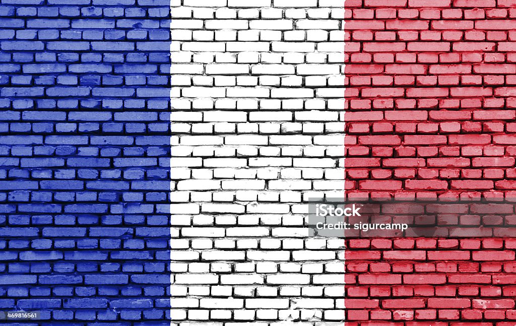 France flag on a brick wall. French flag on a brick wall. Blue Stock Photo
