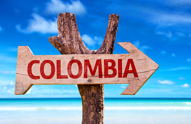 istock Colombia sign with a beach on background 469816950