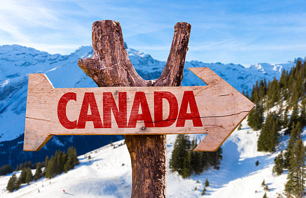 istock Canada wooden sign with alps background 469817028