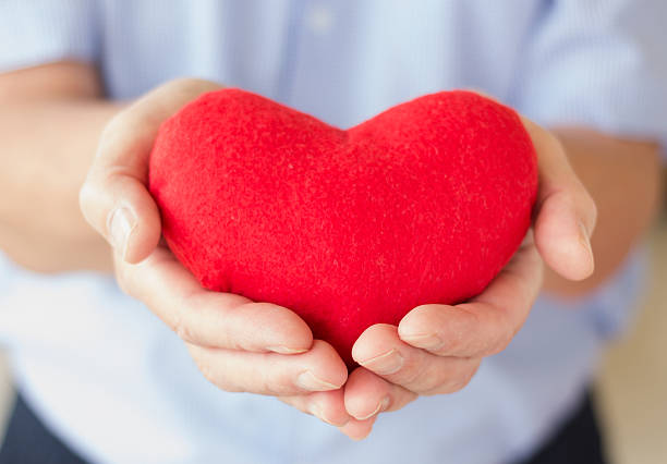 istock Heart in hand of senior man 469817615