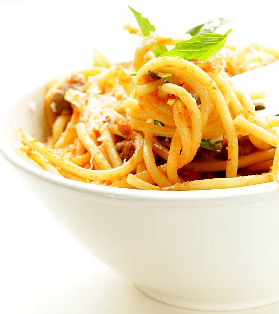 istock spaghetti pasta with tomato sauce, basil and parmesan cheese 469817753