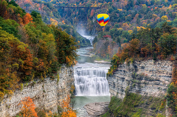 Hot Air Balloon Over The Middle Falls Hot Air Balloon Over The Middle Falls At Letchworth State Park In New York finger lakes stock pictures, royalty-free photos & images