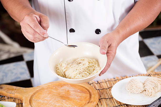 istock Chef cooking Noodle with seasoning sauce 469820136