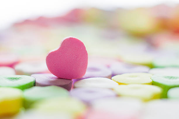 istock Closeup of heart candies with message 469820867