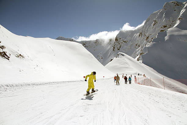 Snowboarding in front of Mont Blanc by winter