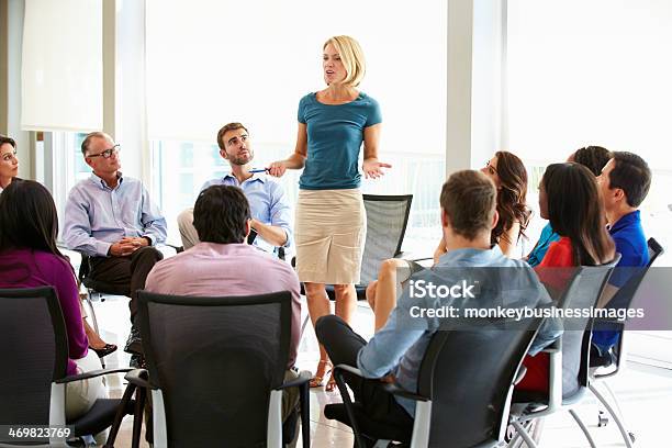 Businesswoman Addressing Multicultural Office Staff Meeting Stock Photo - Download Image Now