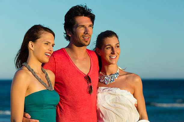 istock Man and women enjoy the sunset 469824051