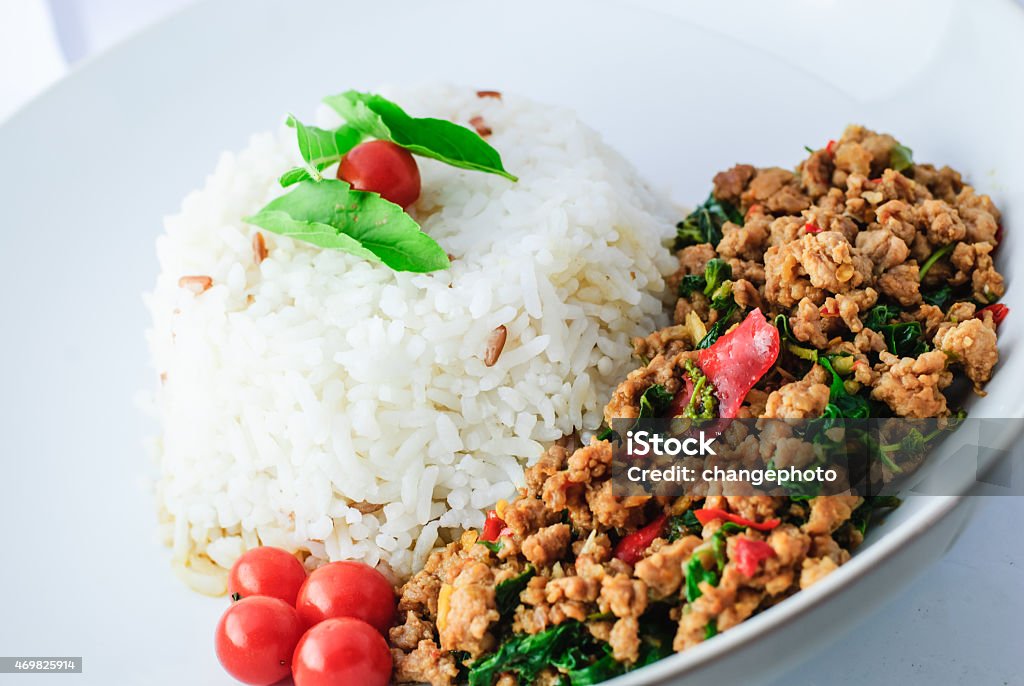 Rice Topped With Stir-fried Pork And Basil Rice Topped With Stir-fried Pork And Basil in white plate 2015 Stock Photo