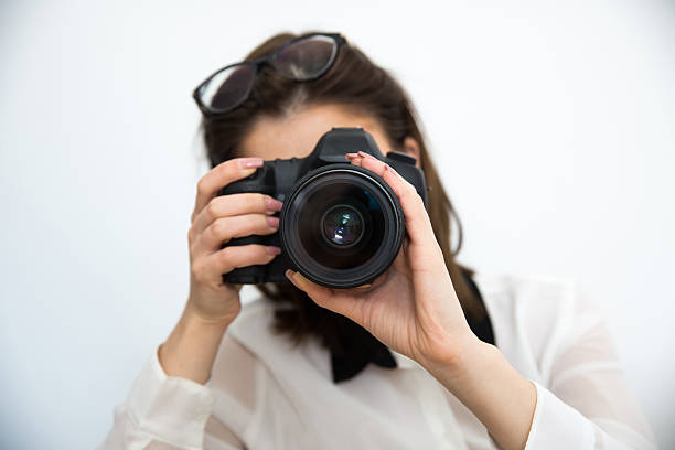 istock Woman photographer with camera 469826784