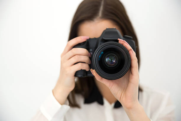 istock Woman photographer with camera 469826928