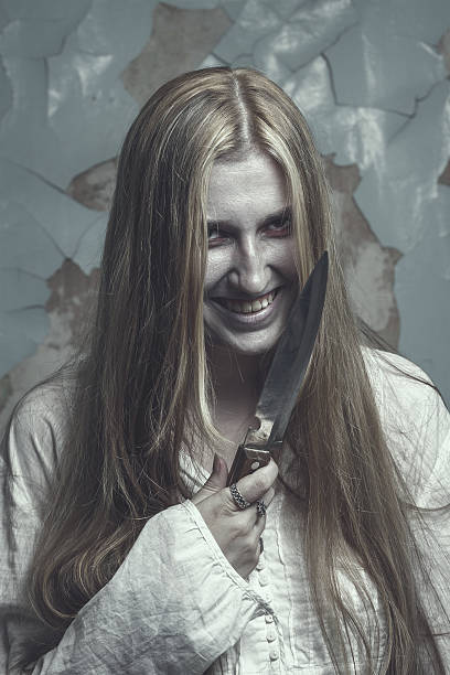 istock zombie girl over cracked wall 469827571