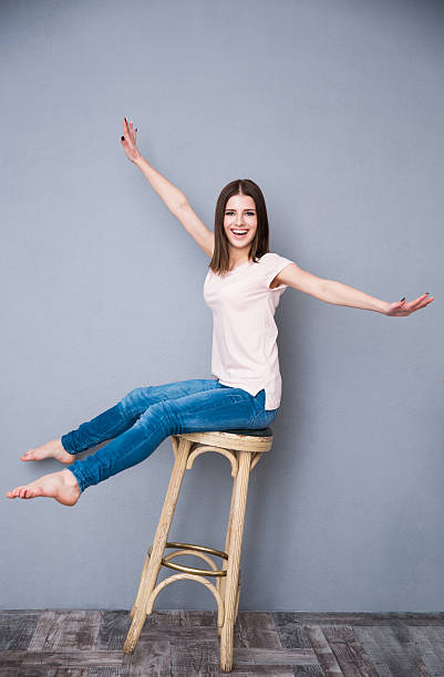 istock woman sitting on the chair 469829990