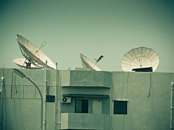 istock Dish antennas are fitted on terrace at different angles 469830233