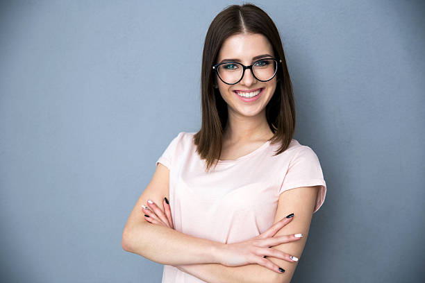 istock young woman with arms folded 469830572