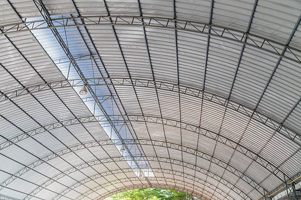 istock metal roofing construction of modern building complex 469831002