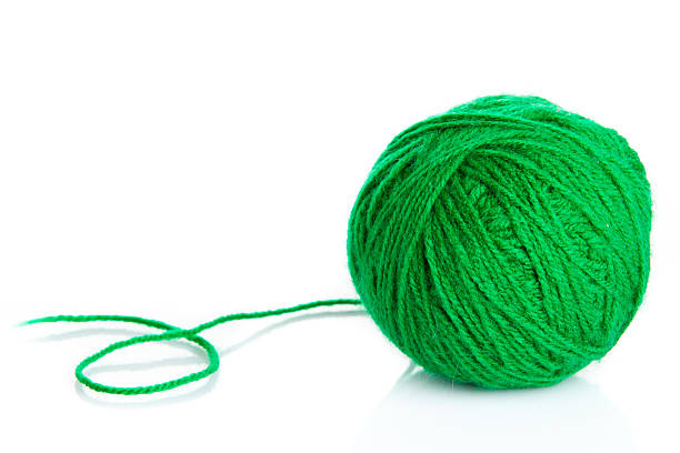 istock Green wool yarn ball isolated on white  background 469831009