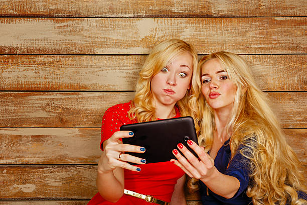 istock Sisters communicate in social networks, selfie 469831872
