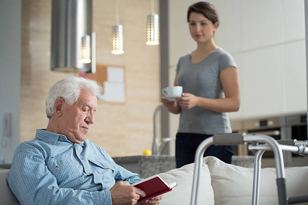 istock Granddaughter helping her disabled grandpa 469834980