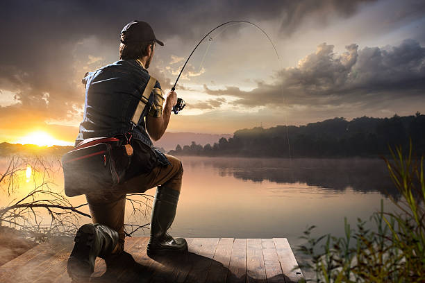 istock man fishing on a lake 469835188