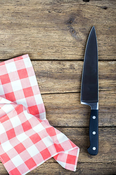 istock Cutting board with napkin and knife 469835464