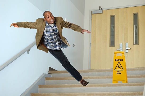 istock Businessman Falling on Stairwell 469836068