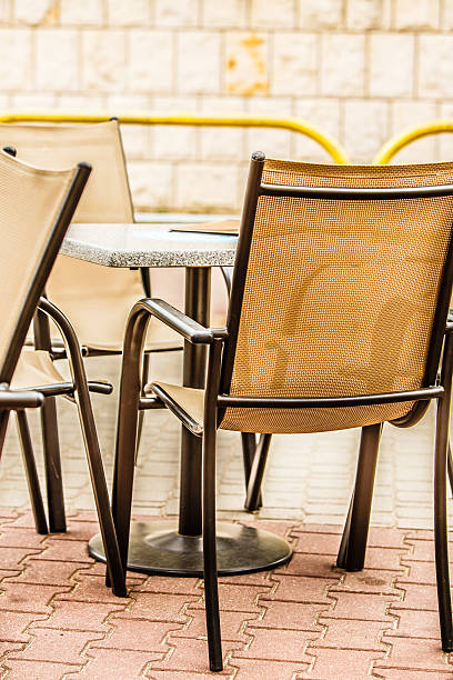istock white and black restaurant chairs outdoor. Open cafe. 469839938