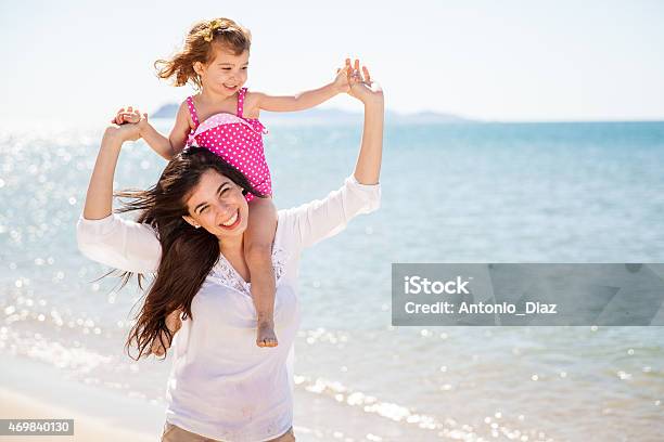 Piggybacking My Mom At The Beach Stock Photo - Download Image Now - 2015, Adult, Beach