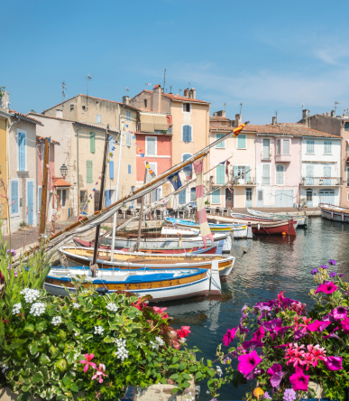 Martigues (Bouches-du-Rhone, Provence-Alpes-Cote d'Azur, France): the old harbor with boats and flowers