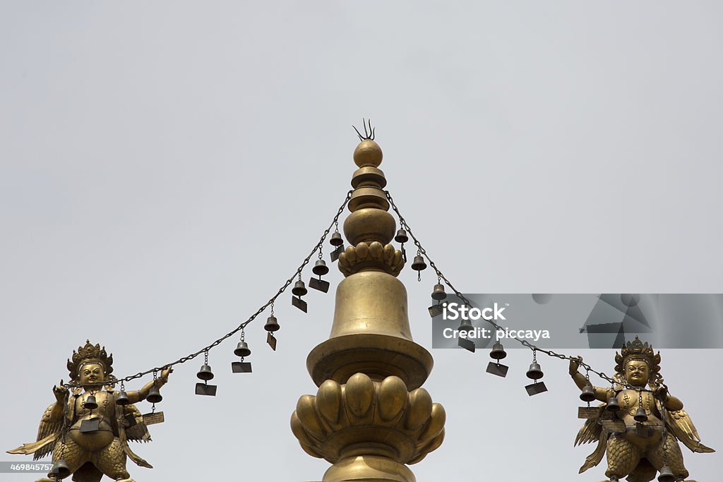 Religious gold symbol on top of a temple Religious gold symbol on top of a temple in Lhasa, China 2013 Ancient Stock Photo