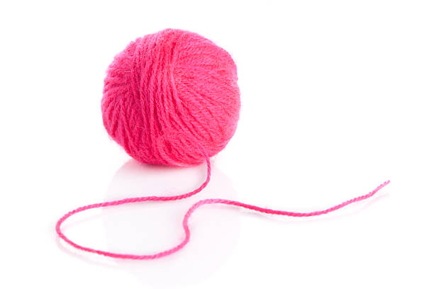istock Pink Yarn Ball  on white background 469845903