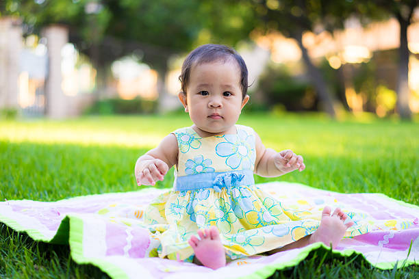 istock little baby playing in the park 469846936