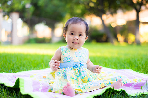 istock little baby playing in the park 469846944