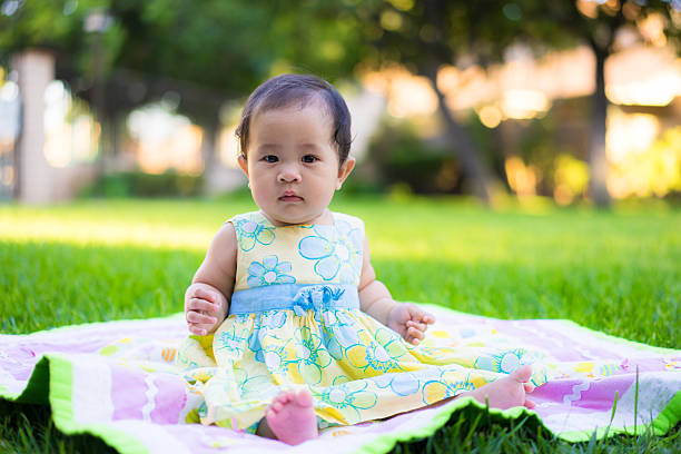 istock little baby playing in the park 469846948